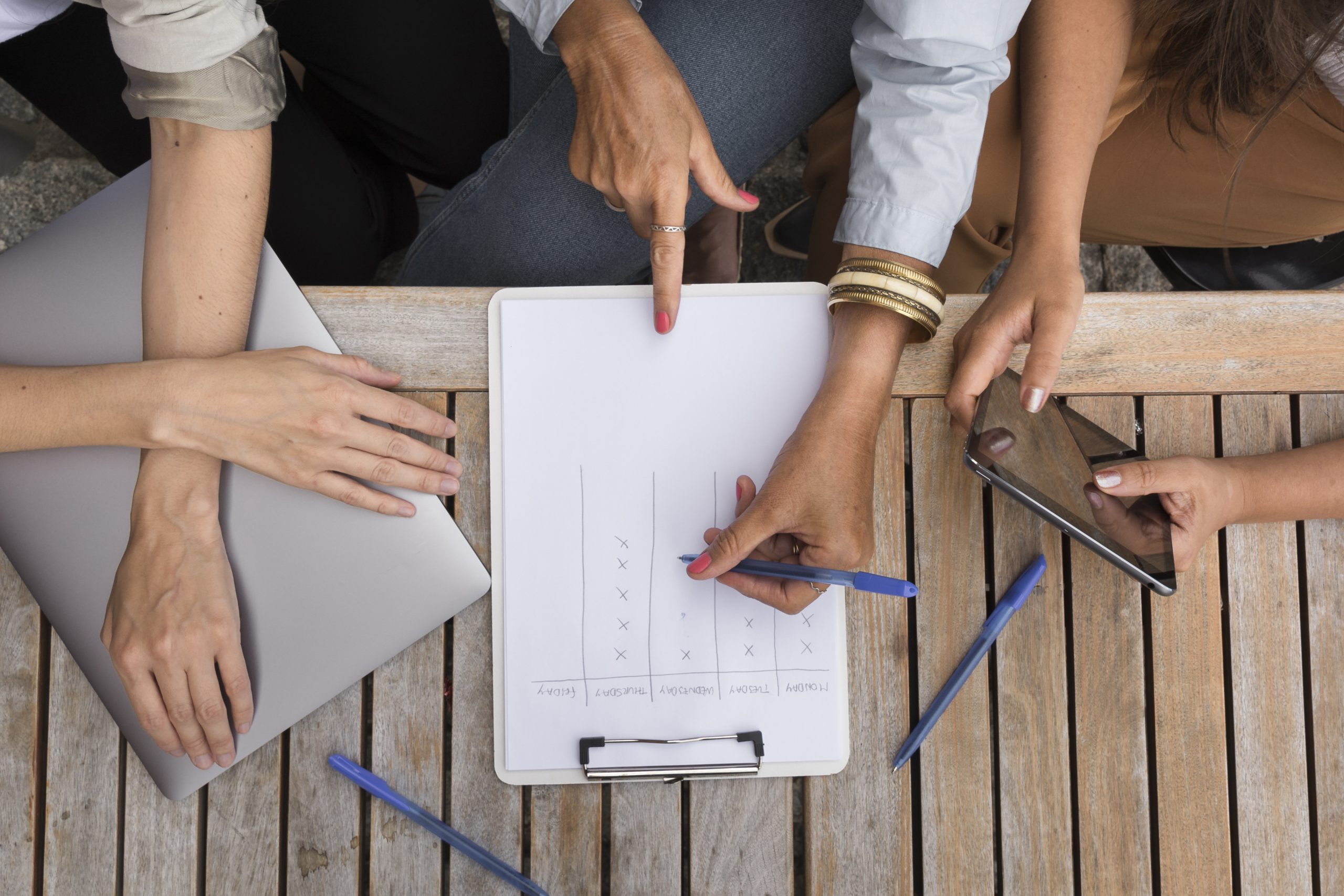 top-view-women-working-together-outdoors-scaled-Income of Renovation Contractors